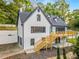 Two-story house with white siding, gray trim, a wooden deck, and a walkout basement at 2552 Hunton Ne Ct, Marietta, GA 30068