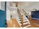 Inviting foyer with hardwood floors, an elegant staircase, and a peek into the stylish living spaces at 2552 Hunton Ne Ct, Marietta, GA 30068