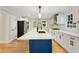 Bright kitchen with a large island, stainless steel appliances, white cabinets, and an adjacent dining area at 2552 Hunton Ne Ct, Marietta, GA 30068