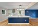 Modern kitchen featuring a large center island with a blue base, quartz countertops, and stainless steel appliances at 2552 Hunton Ne Ct, Marietta, GA 30068