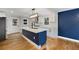 Stylish kitchen showcasing a central island, white cabinetry, stainless steel appliances, and designer backsplash at 2552 Hunton Ne Ct, Marietta, GA 30068