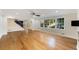 Spacious living room with hardwood floors, staircase access, and expansive windows offering plenty of natural light at 2552 Hunton Ne Ct, Marietta, GA 30068