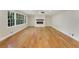 Bright living room with hardwood floors, fireplace, and large windows providing ample natural light and outdoor views at 2552 Hunton Ne Ct, Marietta, GA 30068