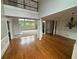 Bright living room with hardwood floors, large windows, and elegant chandelier at 2609 Jacobs Crest Cv, Grayson, GA 30017