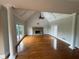 Spacious living room featuring hardwood floors, high ceilings, and a stone fireplace at 2609 Jacobs Crest Cv, Grayson, GA 30017