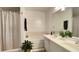 Bright bathroom featuring double sinks, a bathtub with shower, and neutral finishes at 4221 Riverlake Way, Snellville, GA 30039