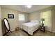 Bright bedroom with a cozy bed, a mirror, and plenty of natural light at 4221 Riverlake Way, Snellville, GA 30039