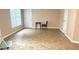 Neutral bonus room with vinyl flooring, natural light and ample space at 4221 Riverlake Way, Snellville, GA 30039