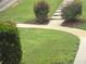 Landscaped front yard with lush green grass and walkway at 4221 Riverlake Way, Snellville, GA 30039