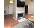Comfortable living room with a fireplace and entertainment center, flooded with natural light at 4221 Riverlake Way, Snellville, GA 30039