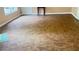 Spacious living room featuring linoleum floors, a white front door, and large windows for plenty of natural light at 4221 Riverlake Way, Snellville, GA 30039
