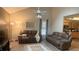 Bright living room with high ceilings, neutral paint, and comfortable leather sofas at 4221 Riverlake Way, Snellville, GA 30039