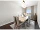 Dining room features a modern chandelier, a neutral color palette, and seating for six at 82 Rising Fawn Ln, Marietta, GA 30060