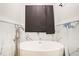 Bathroom features a modern white soaking tub, stylish tiling, and sleek fixtures at 225 Hardwood Dr, Covington, GA 30016