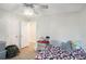 Bedroom with a ceiling fan, hardwood floors, and a window view at 225 Hardwood Dr, Covington, GA 30016