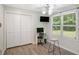 Well-lit room featuring a closet, computer, and ample natural light through the windows at 225 Hardwood Dr, Covington, GA 30016