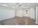 Open living room showcasing light walls, modern flooring, and a view of the entryway at 225 Hardwood Dr, Covington, GA 30016
