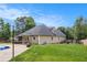 Spacious backyard featuring a well-maintained lawn, patio area, and lush landscaping providing a private oasis at 232 Christian Cir, Carrollton, GA 30116