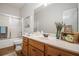 Well-lit bathroom with a shower-tub combo, wood vanity, and decorative accents at 232 Christian Cir, Carrollton, GA 30116