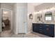 Stylish bathroom featuring double vanity, modern fixtures, and herringbone tile flooring at 232 Christian Cir, Carrollton, GA 30116