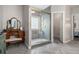 Bathroom featuring glass shower, vanity with a vintage mirror, and neutral color palette at 232 Christian Cir, Carrollton, GA 30116