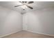 This bedroom features neutral walls, beige carpet, and a ceiling fan for optimal air circulation at 232 Christian Cir, Carrollton, GA 30116