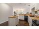 Bright kitchen with butcher block counters, center island, and open layout to the living area at 232 Christian Cir, Carrollton, GA 30116