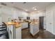 Charming kitchen features white cabinetry, stainless steel appliances, and butcher block countertops at 232 Christian Cir, Carrollton, GA 30116
