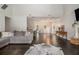 Spacious living room with dark hardwood floors, bright windows, a vaulted ceiling, and a decorative fireplace at 232 Christian Cir, Carrollton, GA 30116