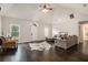 Bright living room features a vaulted ceiling, dark hardwood floors, and a neutral color scheme for a comfortable atmosphere at 232 Christian Cir, Carrollton, GA 30116