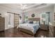 Spacious main bedroom with tray ceiling, dark wood floors, and ensuite bathroom access at 232 Christian Cir, Carrollton, GA 30116