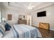 Relaxing main bedroom featuring a tray ceiling, dark wood floors, and ample natural light at 232 Christian Cir, Carrollton, GA 30116