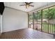 Enjoy the outdoors bug-free in this screened porch overlooking the backyard and wooded landscape at 232 Christian Cir, Carrollton, GA 30116