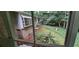 Backyard with green manicured lawn and views of surrounding trees at 2600 Amberly Dr, Dunwoody, GA 30360