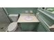 Cozy bathroom features a vanity with white bowl sink, updated toilet, and a shower with glass door at 2600 Amberly Dr, Dunwoody, GA 30360