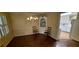Traditional dining room with parquet floors, chandelier, and arched built in, bathed in natural light at 2600 Amberly Dr, Dunwoody, GA 30360