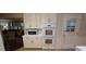 Kitchen appliances including built in double ovens and a microwave in a traditionally styled kitchen at 2600 Amberly Dr, Dunwoody, GA 30360