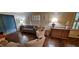 Inviting living room boasts shuttered windows, parquet floors, and charming decor for comfortable living at 2600 Amberly Dr, Dunwoody, GA 30360