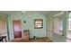 Screened porch with view to an open living space at 2600 Amberly Dr, Dunwoody, GA 30360