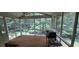 Relaxing screened porch overlooking a lush, green backyard at 2600 Amberly Dr, Dunwoody, GA 30360
