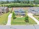 An aerial view of a large two-story home with a well-maintained lawn and mature trees at 2953 Balvenie Pl, Acworth, GA 30101