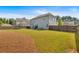Large backyard features a well-maintained lawn and fencing, providing a secure outdoor space at 2953 Balvenie Pl, Acworth, GA 30101