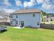A large backyard with well maintained grass, a patio and a trampoline at 2953 Balvenie Pl, Acworth, GA 30101