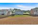 Spacious backyard featuring a large grassy area, trampoline, and privacy fence at 2953 Balvenie Pl, Acworth, GA 30101