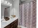 Bathroom with double sink vanity, and a shower and tub combination with patterned shower curtain at 2953 Balvenie Pl, Acworth, GA 30101