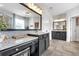 Modern bathroom with granite countertops, dual sinks, tile flooring, and a glass shower enclosure at 2953 Balvenie Pl, Acworth, GA 30101