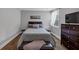 Cozy bedroom with a queen-sized bed, soft lighting, and a view of the outdoors at 2953 Balvenie Pl, Acworth, GA 30101
