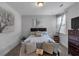 Comfortable bedroom features neutral decor, soft bedding, and ample natural light from the window at 2953 Balvenie Pl, Acworth, GA 30101