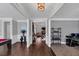 Spacious entryway featuring hardwood floors, elegant trim, and an open floor plan at 2953 Balvenie Pl, Acworth, GA 30101