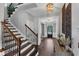 Inviting foyer with hardwood floors, staircase, and decorative lighting at 2953 Balvenie Pl, Acworth, GA 30101